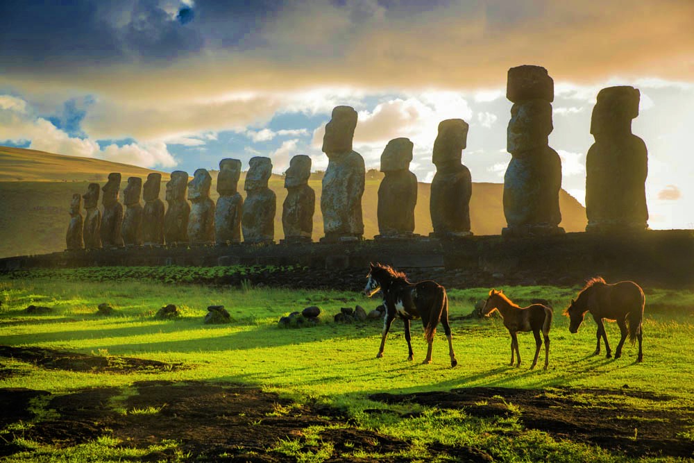 Horses roam in front of Ahu Tongariki on Easter Island’s east coast.